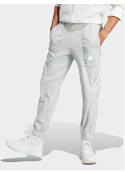 adidas Spodnie dresowe Future Icons 3-Stripes IJ8860 Szary Regular Fit ze sklepu MODIVO w kategorii Spodnie męskie - zdjęcie 168530688