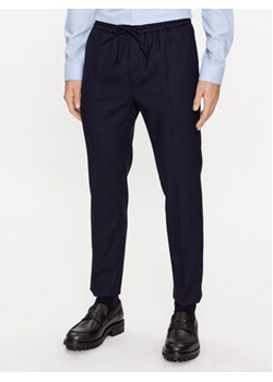 Calvin Klein Spodnie materiałowe K10K109956 Granatowy Regular Fit ze sklepu MODIVO w kategorii Spodnie męskie - zdjęcie 168534098