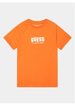 Guess T-Shirt L3BI18 J1314 Pomarańczowy Regular Fit ze sklepu MODIVO w kategorii T-shirty chłopięce - zdjęcie 168534355