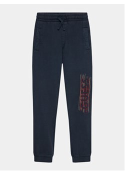 Guess Spodnie dresowe L3BQ12 KAD74 Granatowy Relaxed Fit ze sklepu MODIVO w kategorii Spodnie chłopięce - zdjęcie 168534976