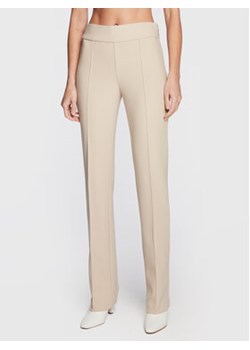 Marciano Guess Spodnie materiałowe 3RGB146869Z Beżowy Regular Fit ze sklepu MODIVO w kategorii Spodnie damskie - zdjęcie 168542775