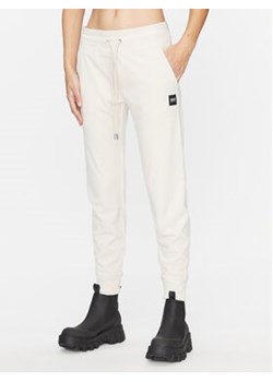 DKNY Sport Spodnie dresowe DP3P1854 Beżowy Regular Fit ze sklepu MODIVO w kategorii Spodnie damskie - zdjęcie 168545759