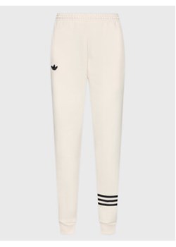 adidas Spodnie dresowe Joggers IB7320 Écru Loose Fit ze sklepu MODIVO w kategorii Spodnie damskie - zdjęcie 168546448