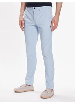 Tommy Hilfiger Chinosy Bleecker 1985 MW0MW26619 Niebieski Slim Fit ze sklepu MODIVO w kategorii Spodnie męskie - zdjęcie 168551569