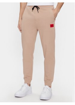 Hugo Spodnie dresowe Doak212 50447963 Beżowy Regular Fit ze sklepu MODIVO w kategorii Spodnie męskie - zdjęcie 168552817