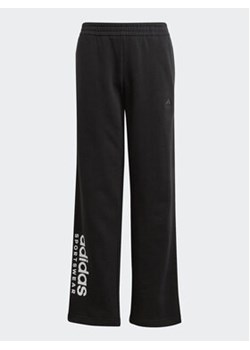 adidas Spodnie dresowe Fleece Kids IL4937 Czarny Loose Fit ze sklepu MODIVO w kategorii Spodnie chłopięce - zdjęcie 168554625