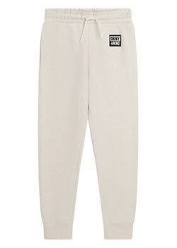 DKNY Spodnie dresowe D34A85 S Biały Regular Fit ze sklepu MODIVO w kategorii Spodnie dziewczęce - zdjęcie 168556019