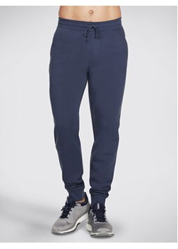 Skechers Spodnie dresowe Sweats Essential Jogger PT16 Szary Regular Fit ze sklepu MODIVO w kategorii Spodnie męskie - zdjęcie 168556198