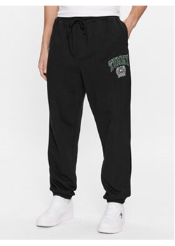Tommy Jeans Spodnie dresowe College Graphic DM0DM16772 Czarny Relaxed Fit ze sklepu MODIVO w kategorii Spodnie męskie - zdjęcie 168565239