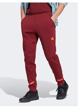 adidas Spodnie dresowe Designed for Gameday Tracksuit Bottoms IC8035 Czerwony Slim Fit ze sklepu MODIVO w kategorii Spodnie męskie - zdjęcie 168566595