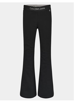 Calvin Klein Jeans Spodnie materiałowe Punto Tape Flare IG0IG02097 Czarny Slim Fit ze sklepu MODIVO w kategorii Spodnie dziewczęce - zdjęcie 168576259