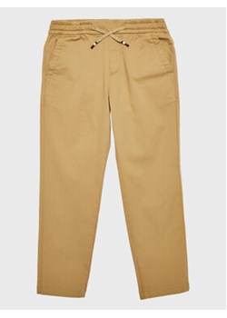 Tommy Hilfiger Spodnie materiałowe KB0KB07980 D Brązowy Tapered Fit ze sklepu MODIVO w kategorii Spodnie chłopięce - zdjęcie 168581529