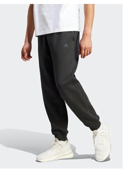 adidas Spodnie dresowe IR8360 Czarny Regular Fit ze sklepu MODIVO w kategorii Spodnie męskie - zdjęcie 168586787