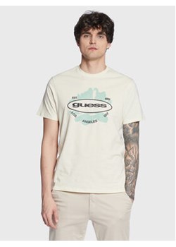 Guess T-Shirt Logo M3GI61 K9RM1 Écru Slim Fit ze sklepu MODIVO w kategorii T-shirty męskie - zdjęcie 168590857