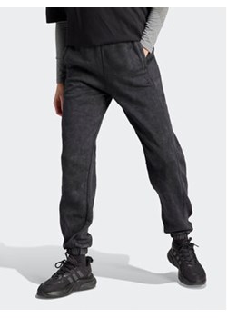 adidas Spodnie dresowe ALL SZN Fleece Washed HZ2987 Czarny Loose Fit ze sklepu MODIVO w kategorii Spodnie damskie - zdjęcie 168591475