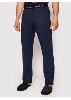 Tommy Hilfiger Spodnie dresowe UM0UM01186 Granatowy Regular Fit ze sklepu MODIVO w kategorii Spodnie męskie - zdjęcie 168592579