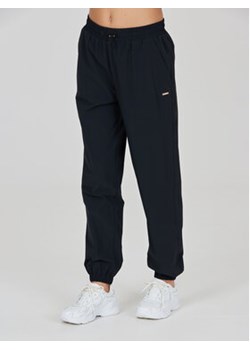 Athlecia Spodnie dresowe Hero W Track Pants EA233336 Czarny Regular Fit ze sklepu MODIVO w kategorii Spodnie męskie - zdjęcie 168608786