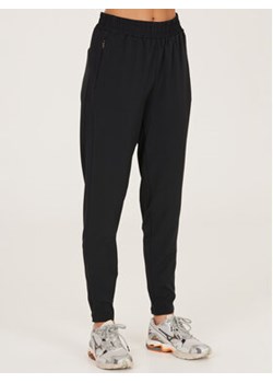 Athlecia Spodnie dresowe Timmie W Pants EA221212 Czarny Regular Fit ze sklepu MODIVO w kategorii Spodnie damskie - zdjęcie 168610015