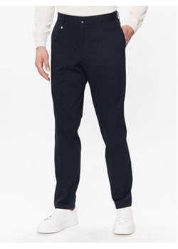 Boss Spodnie materiałowe C-Genius 50485076 Granatowy Slim Fit ze sklepu MODIVO w kategorii Spodnie męskie - zdjęcie 168615637