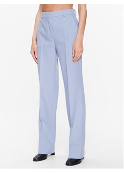 Calvin Klein Spodnie materiałowe Essential Slim Straight K20K205188 Niebieski Regular Fit ze sklepu MODIVO w kategorii Spodnie damskie - zdjęcie 168617065