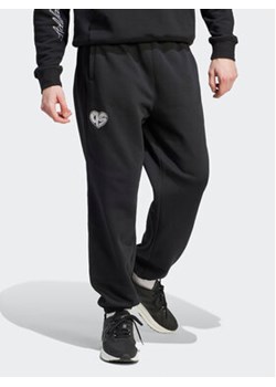 adidas Spodnie dresowe HY1288 Czarny Loose Fit ze sklepu MODIVO w kategorii Spodnie męskie - zdjęcie 168619318