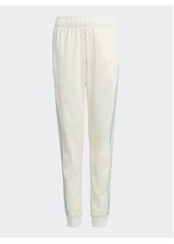 adidas Spodnie dresowe Monogram Print Tracksuit Bottoms IB8621 Biały Regular Fit ze sklepu MODIVO w kategorii Spodnie chłopięce - zdjęcie 168630858