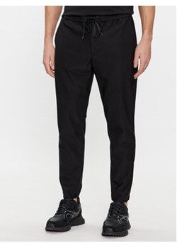 Boss Spodnie dresowe T_Flex 50500615 Czarny Tapered Fit ze sklepu MODIVO w kategorii Spodnie męskie - zdjęcie 168632449