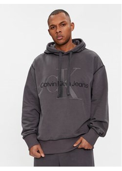Calvin Klein Jeans Bluza Wash Monologo Hoodie J30J324623 Czarny Regular Fit ze sklepu MODIVO w kategorii Bluzy męskie - zdjęcie 168635648