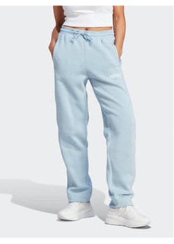 adidas Spodnie dresowe All SZN Fleece Graphic IL3244 Niebieski Loose Fit ze sklepu MODIVO w kategorii Spodnie damskie - zdjęcie 168643226