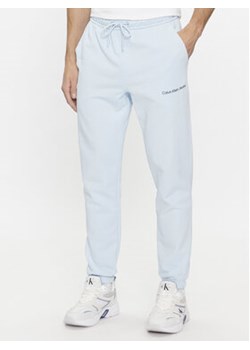 Calvin Klein Jeans Spodnie dresowe Institutional Hwk Pant J30J324739 Niebieski Regular Fit ze sklepu MODIVO w kategorii Spodnie męskie - zdjęcie 168651876