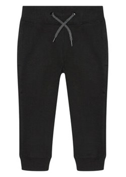 NAME IT Spodnie dresowe Solid Coloured 13153684 Czarny Regular Fit ze sklepu MODIVO w kategorii Spodnie chłopięce - zdjęcie 168655056