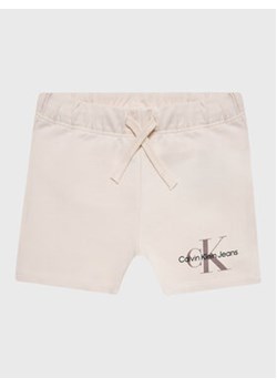 Calvin Klein Jeans Szorty sportowe Monogram Logo IN0IN00061 Beżowy Regular Fit ze sklepu MODIVO w kategorii Spodenki niemowlęce - zdjęcie 168655305