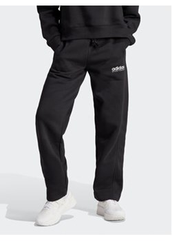 adidas Spodnie dresowe All SZN Fleece Graphic HZ5802 Czarny Loose Fit ze sklepu MODIVO w kategorii Spodnie damskie - zdjęcie 168655647