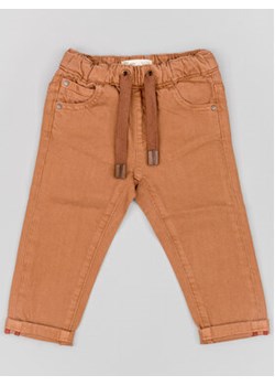 Zippy Spodnie materiałowe ZBBAP0401 23013 Brązowy Regular Fit ze sklepu MODIVO w kategorii Spodnie chłopięce - zdjęcie 168668108