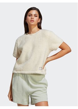 adidas T-Shirt Essentials+ Fluffy IC2257 Écru Loose Fit ze sklepu MODIVO w kategorii Bluzki damskie - zdjęcie 168680195