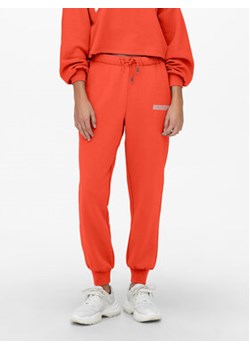 ONLY Spodnie dresowe 15239890 Pomarańczowy Regular Fit ze sklepu MODIVO w kategorii Spodnie damskie - zdjęcie 168693745