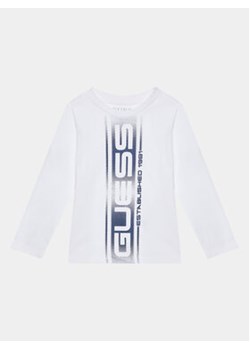 Guess Bluzka N3BI22 I3Z13 Biały Regular Fit ze sklepu MODIVO w kategorii T-shirty chłopięce - zdjęcie 168754725