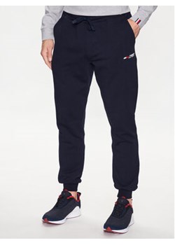 Tommy Hilfiger Spodnie dresowe Essenial MW0MW30397 Granatowy Regular Fit ze sklepu MODIVO w kategorii Spodnie męskie - zdjęcie 168761485