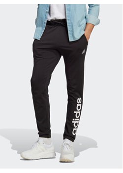 adidas Spodnie dresowe Essentials Single Jersey Tapered Elasticized Cuff Logo Joggers IC0055 Czarny Regular Fit ze sklepu MODIVO w kategorii Spodnie męskie - zdjęcie 168820287