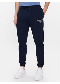 Tommy Jeans Spodnie dresowe Entry DM0DM18935 Granatowy Slim Fit ze sklepu MODIVO w kategorii Spodnie męskie - zdjęcie 168827388