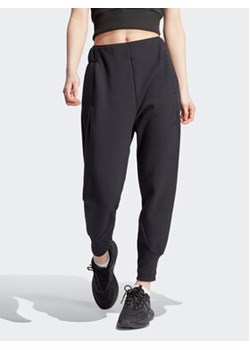 adidas Spodnie dresowe Z.N.E. IN5136 Czarny Regular Fit ze sklepu MODIVO w kategorii Spodnie damskie - zdjęcie 168838556