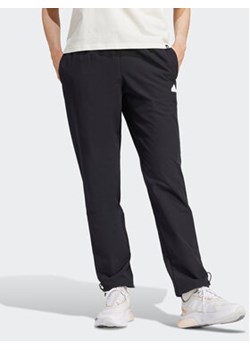 adidas Spodnie dresowe City Escape IT8814 Czarny Regular Fit ze sklepu MODIVO w kategorii Spodnie męskie - zdjęcie 168839906