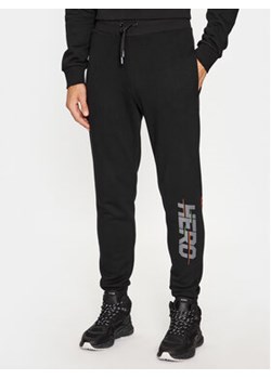 Rossignol Spodnie dresowe Hero RLMMP18 Czarny Regular Fit ze sklepu MODIVO w kategorii Spodnie męskie - zdjęcie 168854818