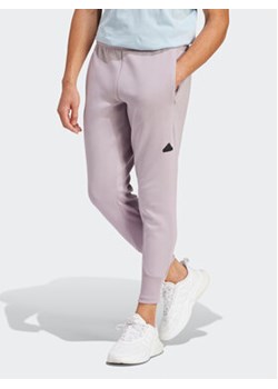 adidas Spodnie dresowe Z.N.E. Premium IR5214 Fioletowy Regular Fit ze sklepu MODIVO w kategorii Spodnie męskie - zdjęcie 168855175