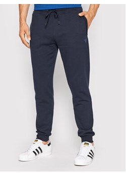 Guess Spodnie dresowe Z2YB22 KAIJ1 Granatowy Regular Fit ze sklepu MODIVO w kategorii Spodnie męskie - zdjęcie 168934947