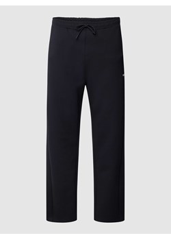 Spodnie dresowe z nadrukiem z logo model ‘Hadim’ ze sklepu Peek&Cloppenburg  w kategorii Spodnie męskie - zdjęcie 168990308