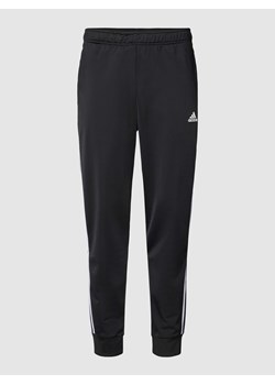 Spodnie sportowe o kroju regular fit z nadrukiem z logo ze sklepu Peek&Cloppenburg  w kategorii Spodnie męskie - zdjęcie 168992926