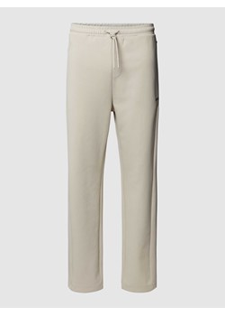 Spodnie dresowe z nadrukiem z logo model ‘Hadim’ ze sklepu Peek&Cloppenburg  w kategorii Spodnie męskie - zdjęcie 168993618