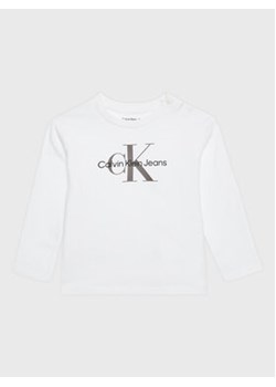 Calvin Klein Jeans Bluzka Monogram IN0IN00005 Biały Regular Fit ze sklepu MODIVO w kategorii T-shirty chłopięce - zdjęcie 169049016