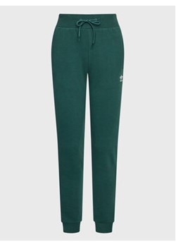 adidas Spodnie dresowe adicolor Essentials HS6781 Zielony Slim Fit ze sklepu MODIVO w kategorii Spodnie damskie - zdjęcie 169052419